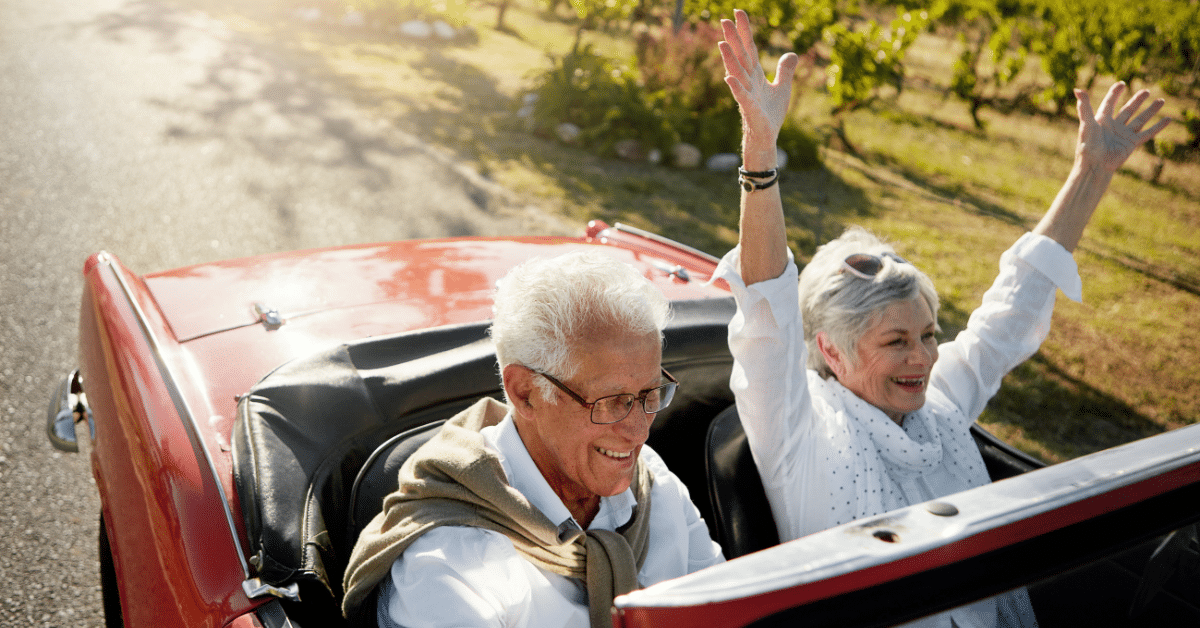 Wealthway – Blog Images senior couple enjoying a ride in a convertible with the top down